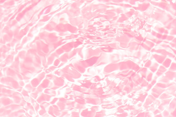Pink water bubbles on the surface ripples. Defocus blurred transparent pink colored clear calm...