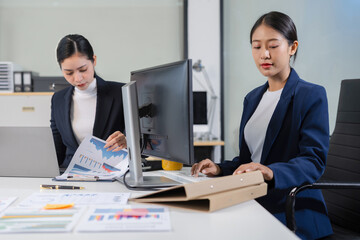 Professional investor working new start up project. Finance managers meeting.using laptop and digital tablet computer in office.