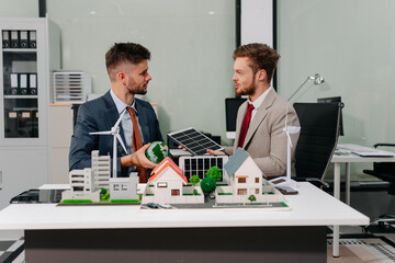 blueprint and site building job for architect, builder and engineer sketching a construction project, green energy and solar panel concept.