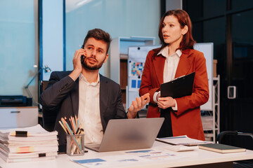 Business people work overtime meeting design ideas concept business planning at office.