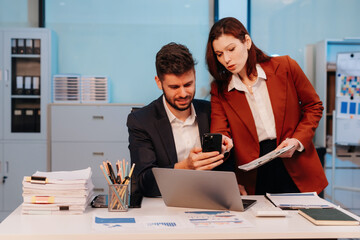 Project manager working overtime and update tasks with milestones progress planning and professional investor working new start up project in the office.