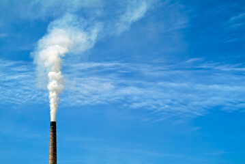 Smoking Factory Chimney pumping out pollution into the atmosphere. Bosnia Herzegovina, Eastern...