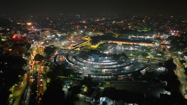 Aerial night view of the Kempegowda Bus Station in Bengalur. Night view of the majestic bus stand with buses parked and moving to different spots in metropolitan city of Bangalore
