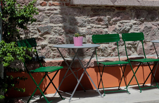 colorful, vibrant photographs taken on a summer day on Cunda Island. Green chairs, doors, walls. Vintage designs of restaurants and cafes in touch with nature.