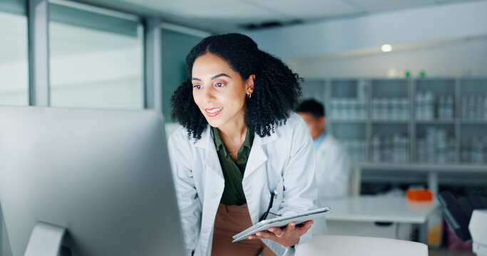 Computer, science and tablet with woman in laboratory to report breakthrough or discovery. Healthcare, investigation and medical research with happy scientist at work on clinical trial for experiment