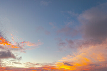 Aerial view clouds are moving slowly in the yellow sky at sunset..amazing cloud in yellow sky in beautiful sunset above the sea..colorful sky sunset or sunrise background.