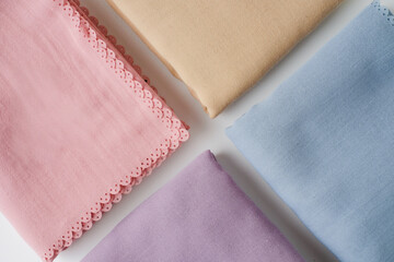 hijab headscarf fabric folded in many color on a white background
