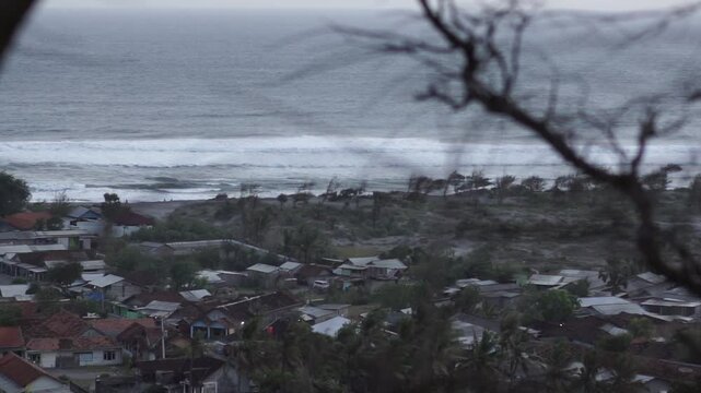 Peaceful Coastal Village Near Sandy Hills and Calm Beach