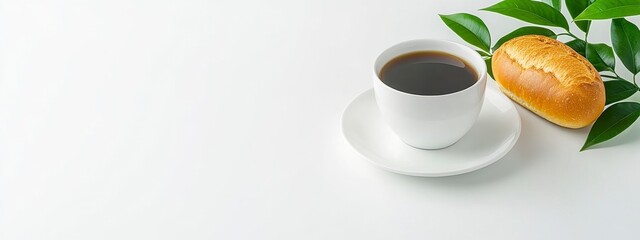 Black Coffee and Bread Roll on White Background