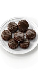 Obraz premium A realistic photograph of dark chocolate macarons, placed on an empty white plate, isolated against