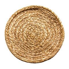 Close up of a round woven straw mat with a spiral pattern on a white background in bright studio light