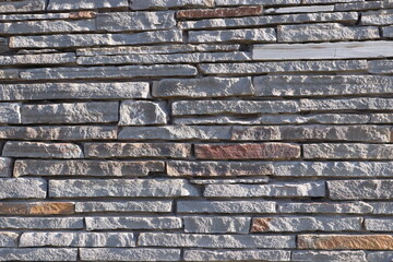 Naklejka premium Stone Slate Walls Brickwork Slim Strip Rectangular Bricks uniform neat texture surface background