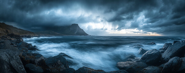 Dramatic coastal seascape with dark clouds and rugged rocks in Lofoten Norway