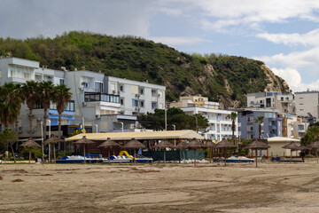 City and Bay View from the Mountain in Shkëmbi i Kavajës, Albania. The image showcases the charming coastal town nestled along the shoreline, with its buildings and beach stretching towards the horizo