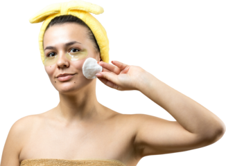 Young beautiful girl in a white towel on his head wears collagen gel patches under her eyes. Mask under eyes treatment face.