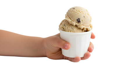 A child's hand holding a white cup filled with scoops of chocolate chip ice cream against black backdrop