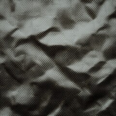 Fototapeta premium Close-up of Textured Dark Gray Carbon Fiber Material Showing Subtle Wrinkles and Uneven Surface Detail
