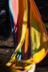 Vibrant and Colorful Hammock Fabric Draped Beautifully in Natural Light, Inviting Relaxation on a...