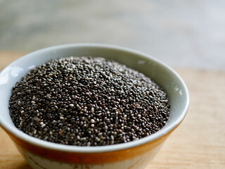 Close-up image of chia seeds on a bowl. Chia seeds are tiny, nutrient-packed grains known for their powerful health benefits and versatility