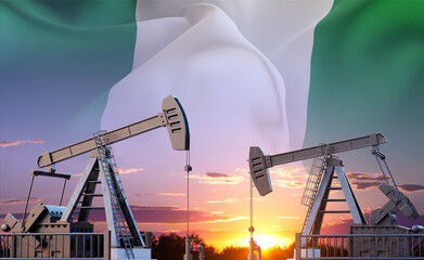 Oil pumpjacks against the sunset with Nigeria flag. Oil industry concept