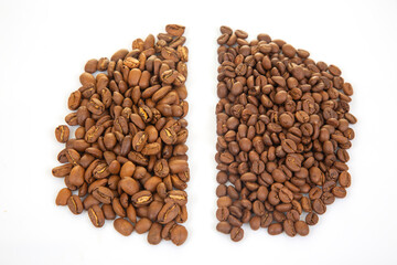 Roasted coffee beans in light and dark brown tones, arranged on a white surface, emphasizing their natural texture and split lines. Great for beverage photography.