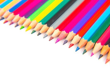 A vibrant collection of colored pencils in a straight line on a white background. Perfect for art education, stationery, or creative inspiration themes.