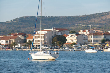 White sailboat floating on calm water in rogoznica, croatia