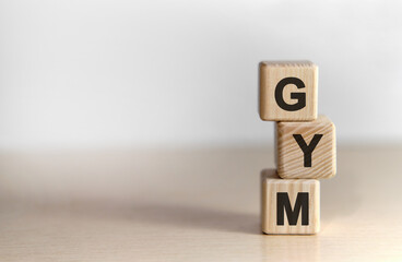 GYM - text on wooden cubes text on a background