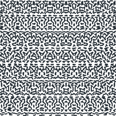 Fototapeta premium Small dots and dashes form an ornament or pattern with symmetrical details.