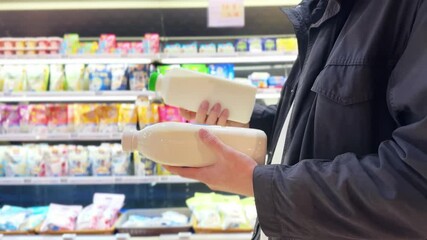 choosing dairy products in the supermarket