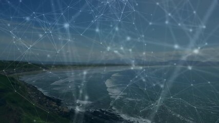 Network of connections and data processing animation over coastal landscape - Powered by Adobe