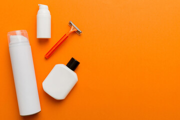 shaving man set. shaving machine, towel, lotion and shaving foam on colored background. Men bath Accessories top view