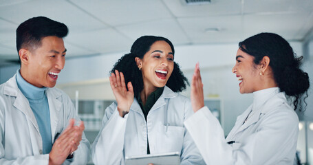 High five, teamwork and scientists in laboratory with medical project, discovery and study. Happy,...