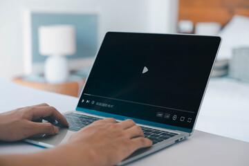 Video streaming on internet concept, A man ues laptop to watching and live streaming window,...