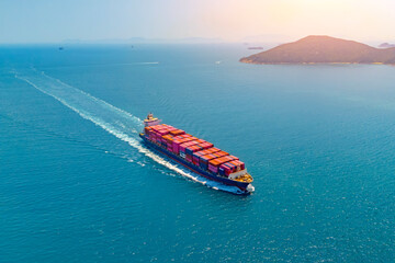 Big container ship heavy ship goes on water, cargo in the sea strait around islands entering the...