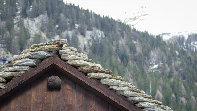 Mountain chalet beole roof detail in the Northern Italy Alps, in the village of Macugnaga. Is a small village in the Piedmont Region at the Rosa massif slopes.