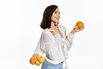 Bright summer vibes with a stylish young woman holding fresh fruits in trendy attire