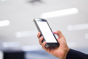 Human Hand using smartphone mobile phone with social media concept.