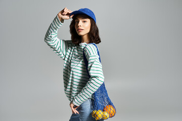 Young woman enjoying summer vibes in a stylish outfit with a playful twist