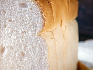Close-up of freshly sliced ​​soft and fragrant bread with white bread,brown bread crust macro