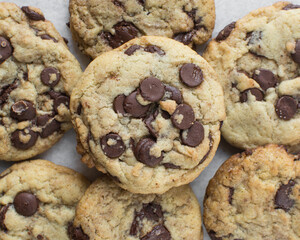 Overhead view of chocolate chip cookies, top view of homemade chocolate chip cookies on a white background