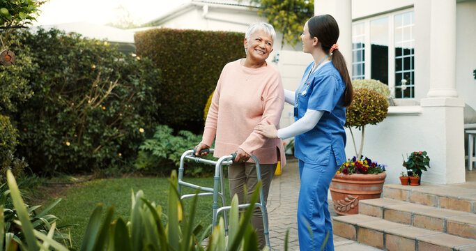 Retirement home, nurse and senior woman with walker outdoor for mobility support, healthcare and healing. Happy, caregiver and elderly person with disability for recovery, rehabilitation or fresh air