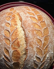 Artisan Bread Featuring a Stunning Scoring Design that Enhances Its Visual Appeal and Flavor