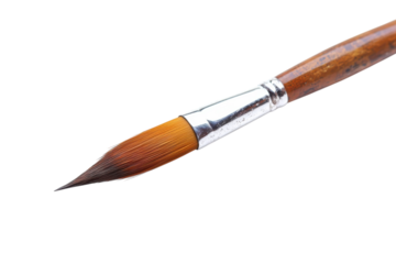 Artistic brush poised for creativity on a pristine white canvas in a cozy studio setting