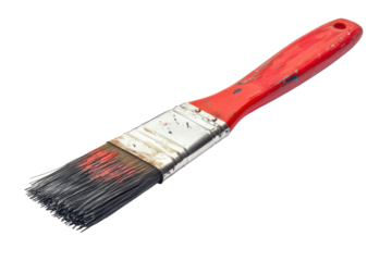 A vibrant red paintbrush rests on a clean surface ready for artistic creativity and expression