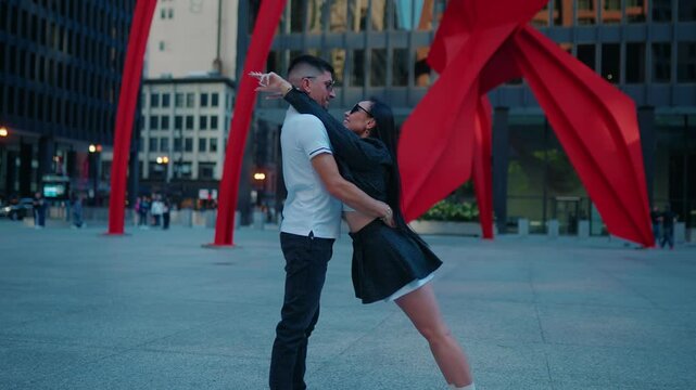 Urban scene with young fresh married couple in Chicago downtown. Love story