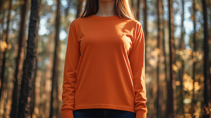 mockup of a woman wearing a plain orange long sleeve t-shirt isolated on forest background, Ai generated images