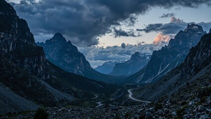 A brooding mountain pass at twilight with jagged peaks under a turbulent sky setting an ominous and majestic tone