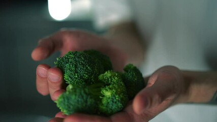 Green broccoli close-up in hands.
Man holding broccoli in hands.
Cauliflower.
Diet food