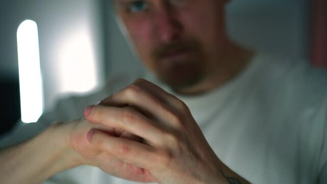 Aggressive behavior in a man.
A troublemaker and an aggressor.
A person is preparing to hit someone.
Rage and hatred.
Evil and negative emotions